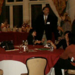people sitted at dinner party table