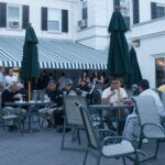 people outside golf club eating food