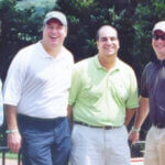 men smiling at golf club