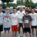 runners gathered together smiling