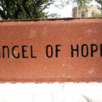 ANGEL OF HOPE etched into brick