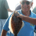 Person smiling after catching fish