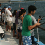 People fishing on large boat