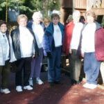 group of women standing next to each other for photo