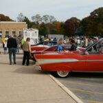 retro cars parked outside of hauppague highschool