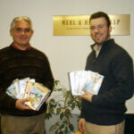Bob with individual holding dvds