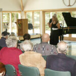 Lady singing for members