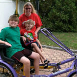 Mother with children riding donated bike